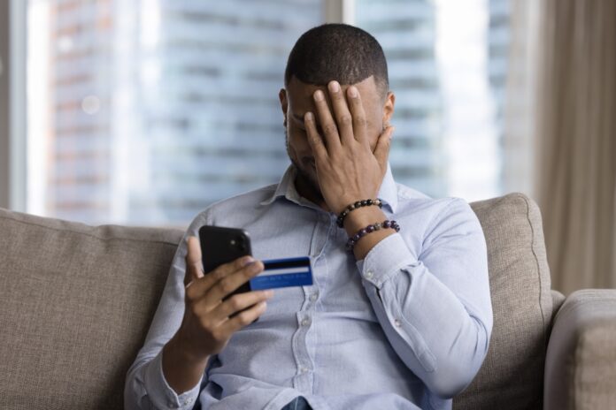 UnsuccessfulPaymentInternetScamFraudVictimUpsetAfricanGuySit Scammer